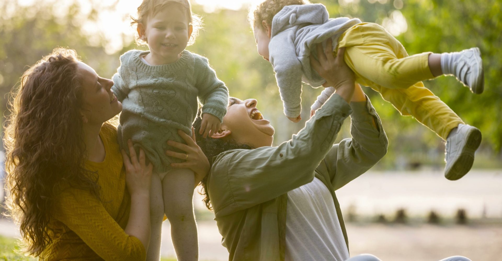 happy-lgbt-mothers-outdoors-park-with-their-children